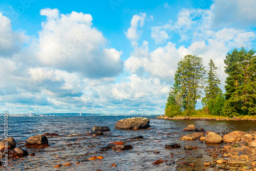 Summer daytime cloudy landscape, Lake Onega, coastline.