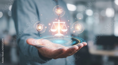 Digital legal symbols floating above a business person hand representing justice compliance law enforcement protection contract and professional corporate ethics
