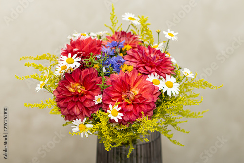 Rustic Garden Bouquet of Red Dahlias Daisies and Blue Cornflowers in a Vase