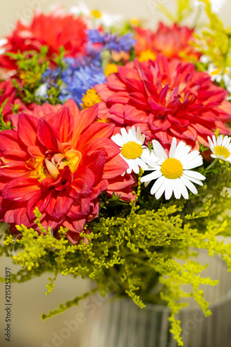 Vibrant Red Dahlias and White Daisies in a Colorful Summer Bouquet