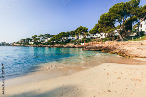 Photography Quiet Cala Petita beach in Mallorca, Spain with clear water.