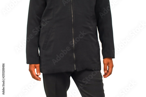 Foto Man Wearing a Black Winter Coat and Trousers Standing Against a White Background