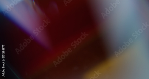 Neon color gleam. Blur rainbow art. Yellow purple blue glisten texture optical light vivid glass leak on abstract vibrant background.