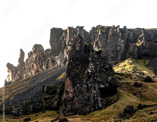 Ancient stone ruins of a medieval fortress in a misty landscape.