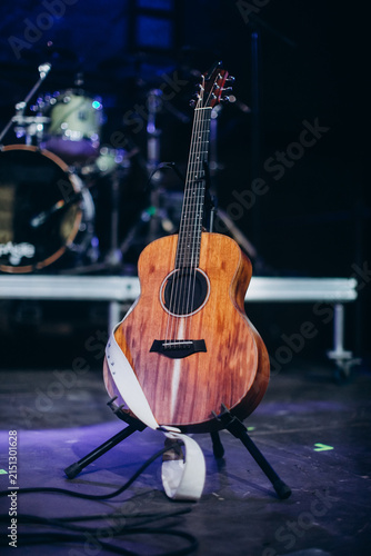 Acoustic guitar standing on stage at concert