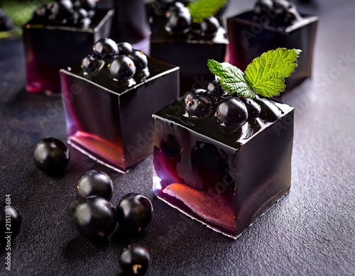 luscious blackcurrant jelly delights square shaped on a seductive dark tabletop