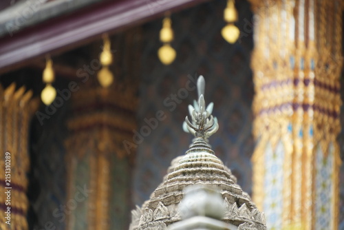 фотографія Visitors admire details of the Grand Palace in Thailand during the day while exp
