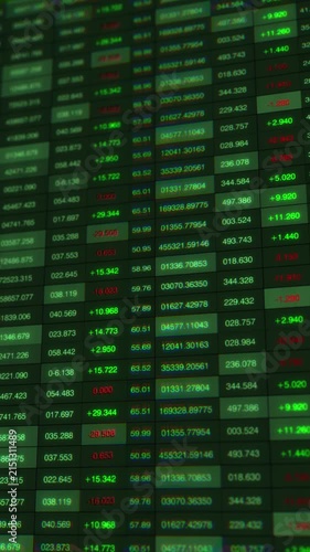 Dynamic Stock Market Data Visualization: Capturing Real-Time Changes in Trading Figures with Green Gains and Red Losses Across Multiple Listings in Vertical Format
