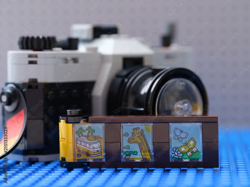 Fototapeta premium Tambov, Russian Federation - February 20, 2026 Lego Creator Retro Camera with film strip accessory with colorful printed scenes in front of it