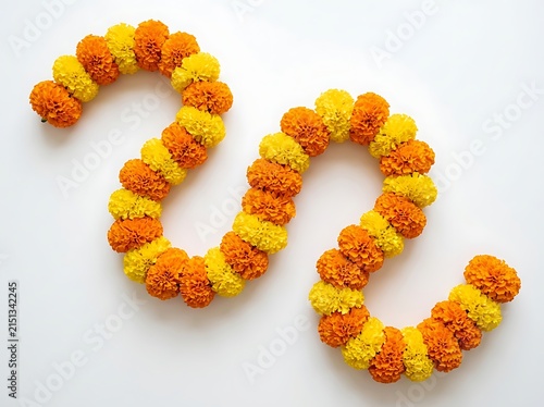 Colorful flower garlands made from orange and yellow marigolds arranged in loops