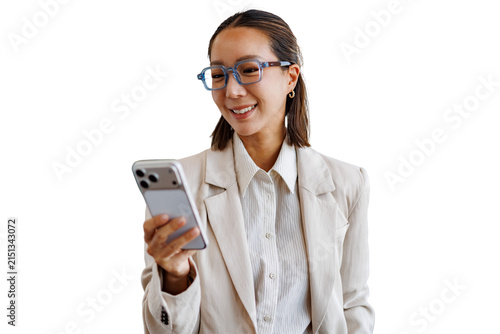 Asian businesswoman smiling and looking at smartphone, communicating with mobile technology, transparent background