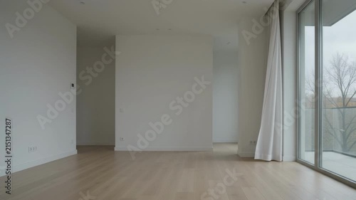 Empty Modern Apartment with Large Window in Soft Autumn Daylight