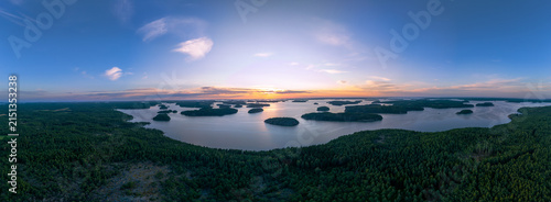 Panoramic aerial view of Finnish Archipelago islands during warm golden hour sunset