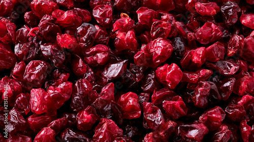 Closeup of dried cranberries, vibrant red texture background, healthy snack, organic food, dried fruit, sweet and tart, culinary ingredient, food photography