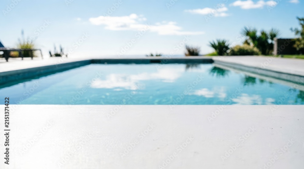 Fototapeta premium Infinity Pool with Ocean View and Blue Sky for Luxury Lifestyle