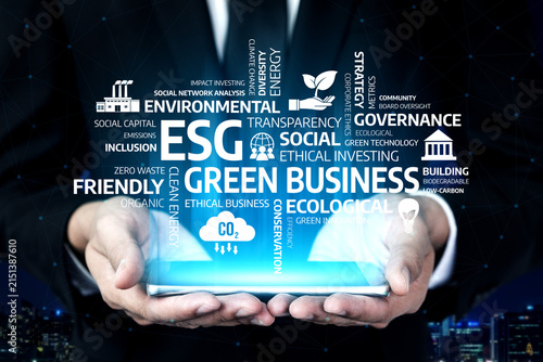 Quadro su tela Hands holding a glowing interface illustrating ESG concepts pivotal for green business