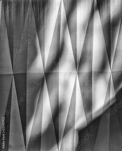 Quadro su tela Abstract Background of Sunlight and Shadows on an Asymmetrical  Stone Wall