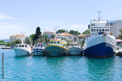 Fishing trawlers and boats moored in Punat harbor, Croatia