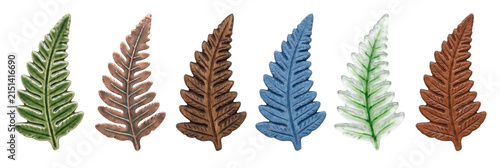 Six decorative fern leaf shaped objects crafted from diverse materials including ceramic, metal, wood, glass, and stone, showcasing a variety of textures and colors