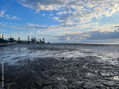 Konstfotografi Scenic low tide view over Moreton Bay under a dramatic cloudy sky