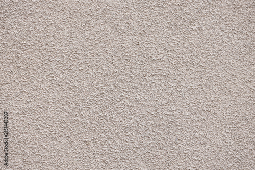 Фотография Textured beige wall surface with a rough finish, showcasing a subtle pattern and