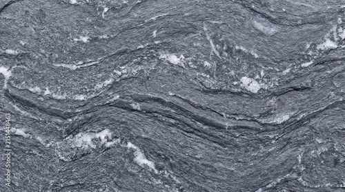 Detailed Macro Texture of Compressed Fine-Grain Grey Metamorphic Quartzite Slate with Quartz Inclusions