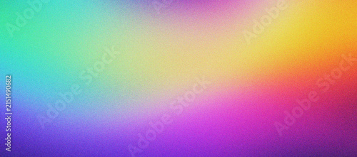 Vibrant rainbow gradient background with grainy texture. Colorful abstract mesh blur in purple, yellow, and teal hues. Soft multi-color light leak wallpaper for modern digital design projects.