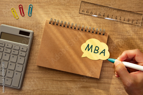 Фотография MBA text on yellow sticky note symbolizing business degree pursuit — ideal eye-c