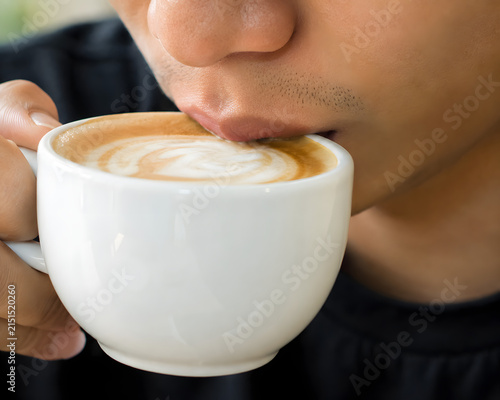man with a cup of coffee cappuccino latte