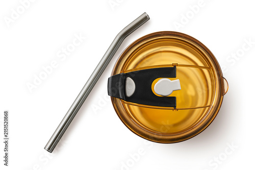 Amber-colored tumbler lid with a slider and reusable metal straw isolated on white background. Perfect for eco-friendly lifestyle products and drinkware accessory mockups.