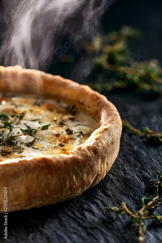 Fototapeta samoprzylepna Goat Cheese Tart with Dramatic Steam and Thyme on Black Slate