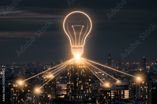 Idea bulb and digital network above a city skyline