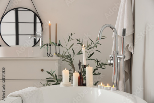 Bathtub with burning candle...