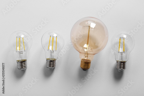 Many light bulbs on grey ba...