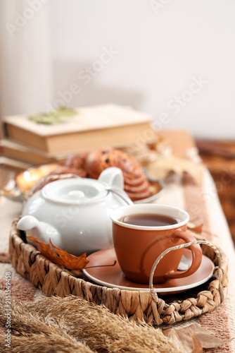 Teapot with cup of hot beve...