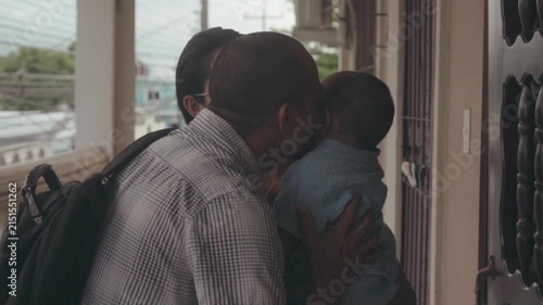 Hispanic father returning home from work