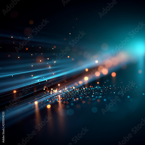 Abstract digital streaks and glowing light particles in dark space with particles