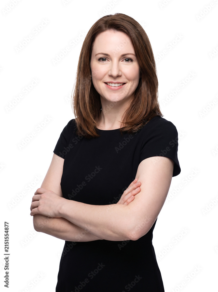 Fototapeta premium Poised brunette woman in black dress with arms crossed