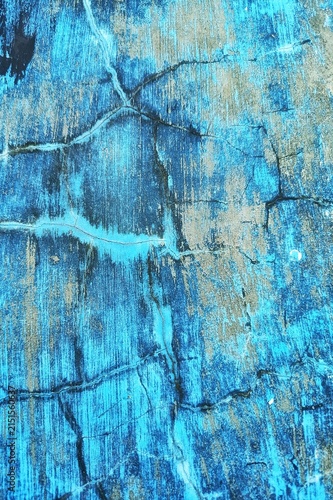 Weathered blue painted wall with cracks background
