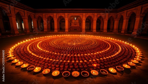 Golden Diwali rangoli with marigold diya glow in ornate brass traditional festival celebration design