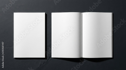 Top view blank white magazine mockup showing closed front cover and open spread with empty pages on a dark charcoal textured background, perfect for editorial design and catalog branding.