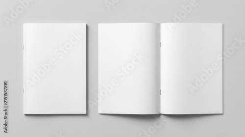 Top-down view of blank white magazine or brochure mockups featuring a closed front cover and open inside spreads with saddle-stitched binding on a clean light gray studio background surface.
