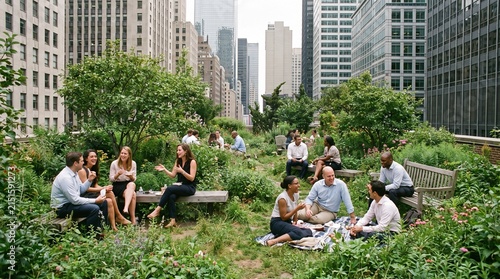 Diverse group of young professionals networking in elevated city park