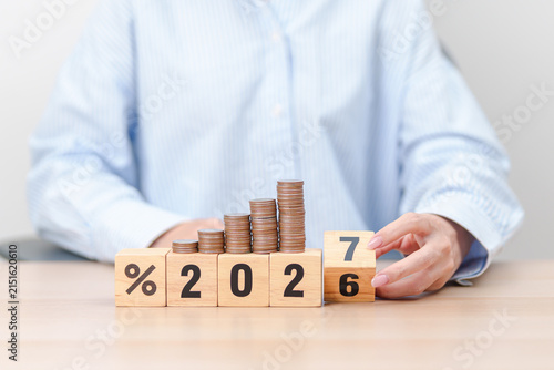 Konstfotografi 2026 to 2027 New year with percentage change to UP and Down arrow with coin stack