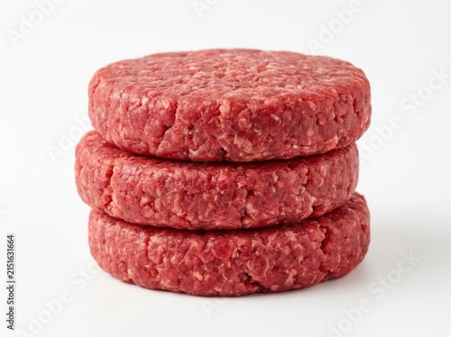 A Stack of Three Fresh Raw Ground Beef Burger Patties on White