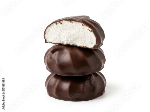 A delicious stack of three round dark chocolate covered marshmallow treats isolated