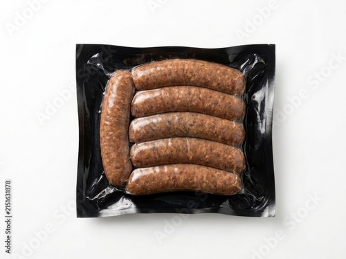 Five Raw Brown Sausages Vacuum Sealed In Shiny Black Plastic Packaging Above