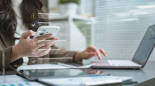 Cuadro en lienzo User reviewing login activity and account session history on a mobile device to monitor security, detect suspicious access, and protect personal accounts