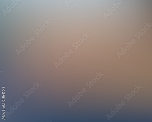 Soft blurred gradient background, with muted blue, and brown tones
