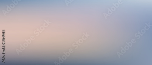 Soft blurred gradient background, with pastel blue, and peach tones